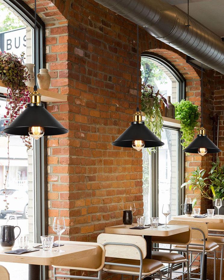 Industrial pendant lighting installed in a contemporary hospitality interior.