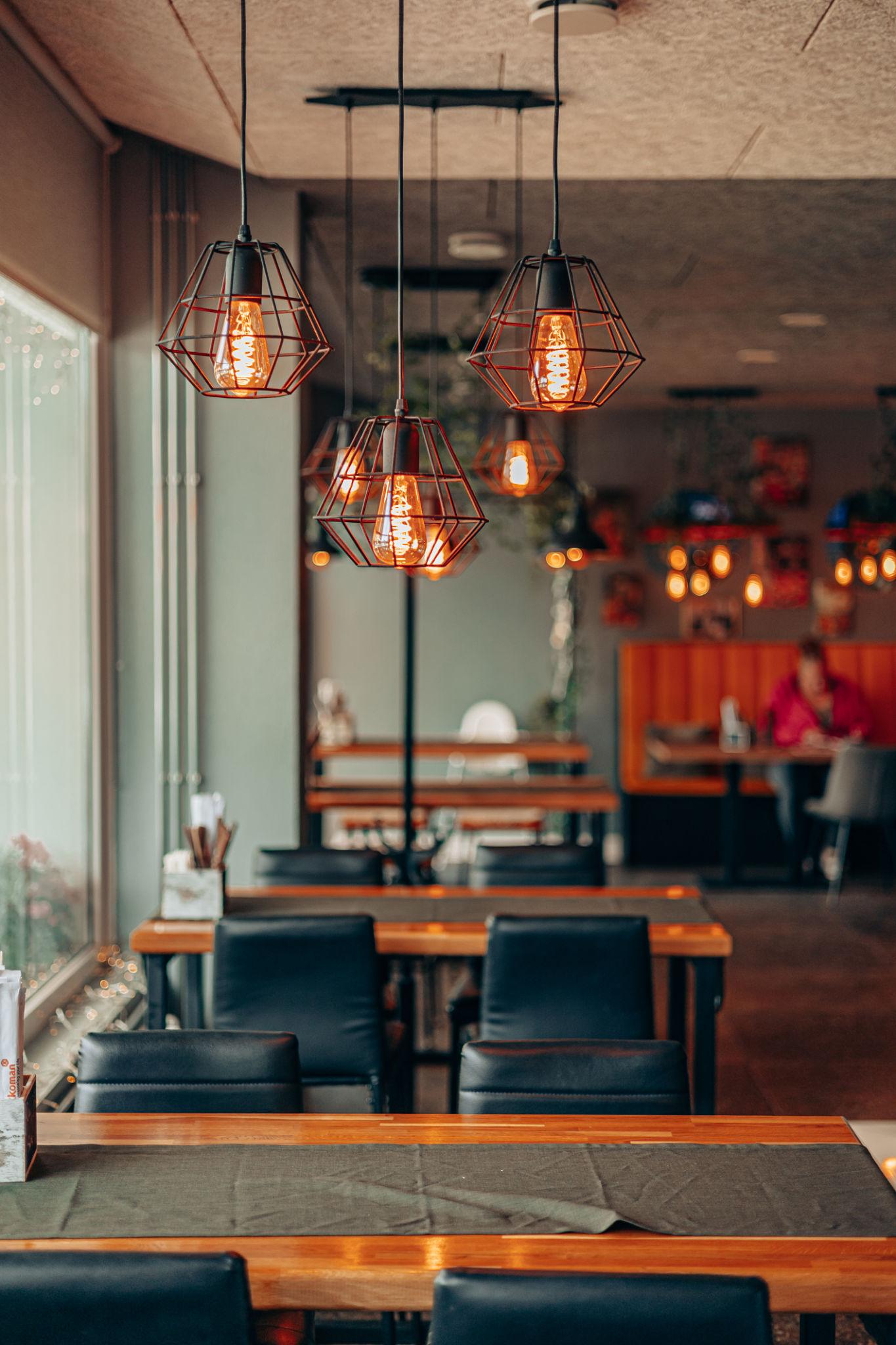 Industrial pendant lighting installed in a contemporary hospitality interior.