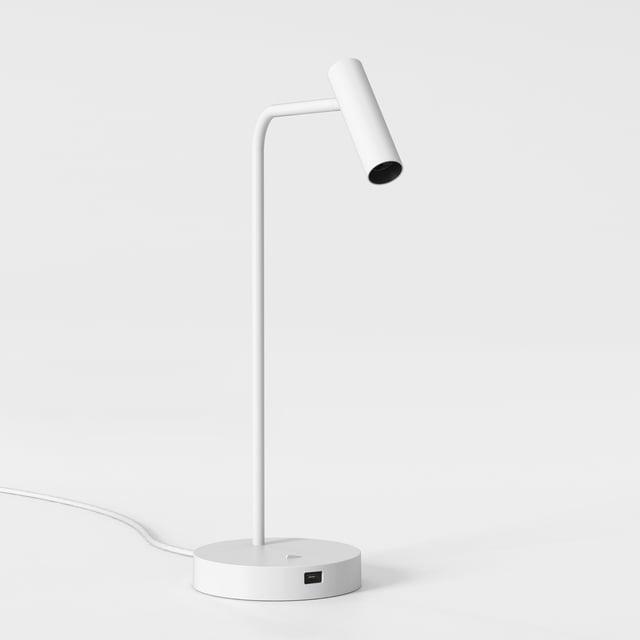 Front view of a minimalist table lamp highlighting its refined proportions and architectural design.