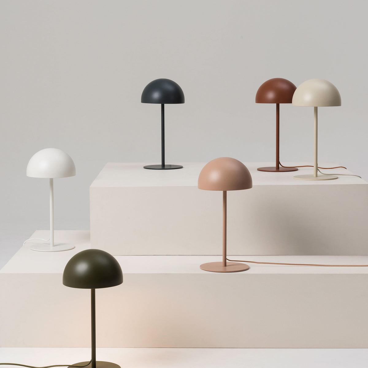 Collection of minimalist table lamps featuring contemporary forms and premium decorative finishes.