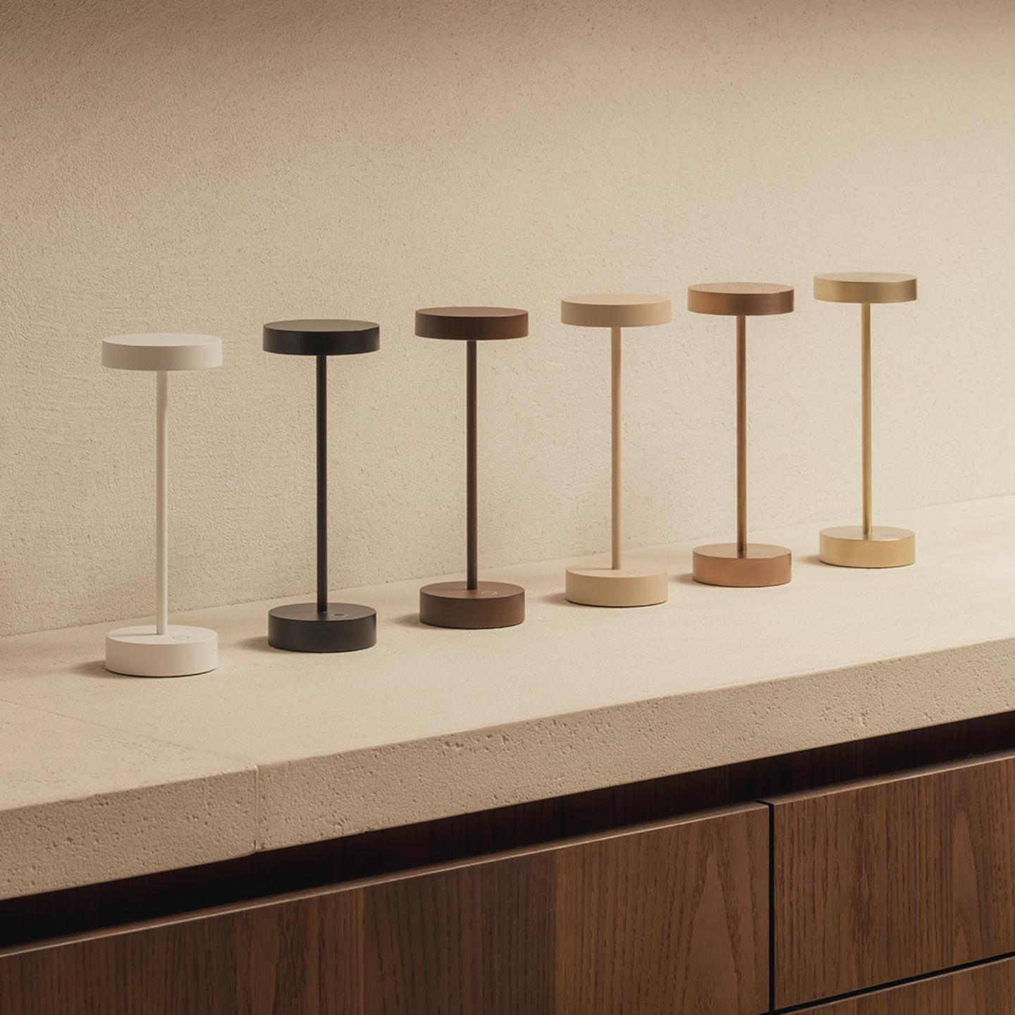 Collection of minimalist table lamps featuring contemporary forms and premium decorative finishes.