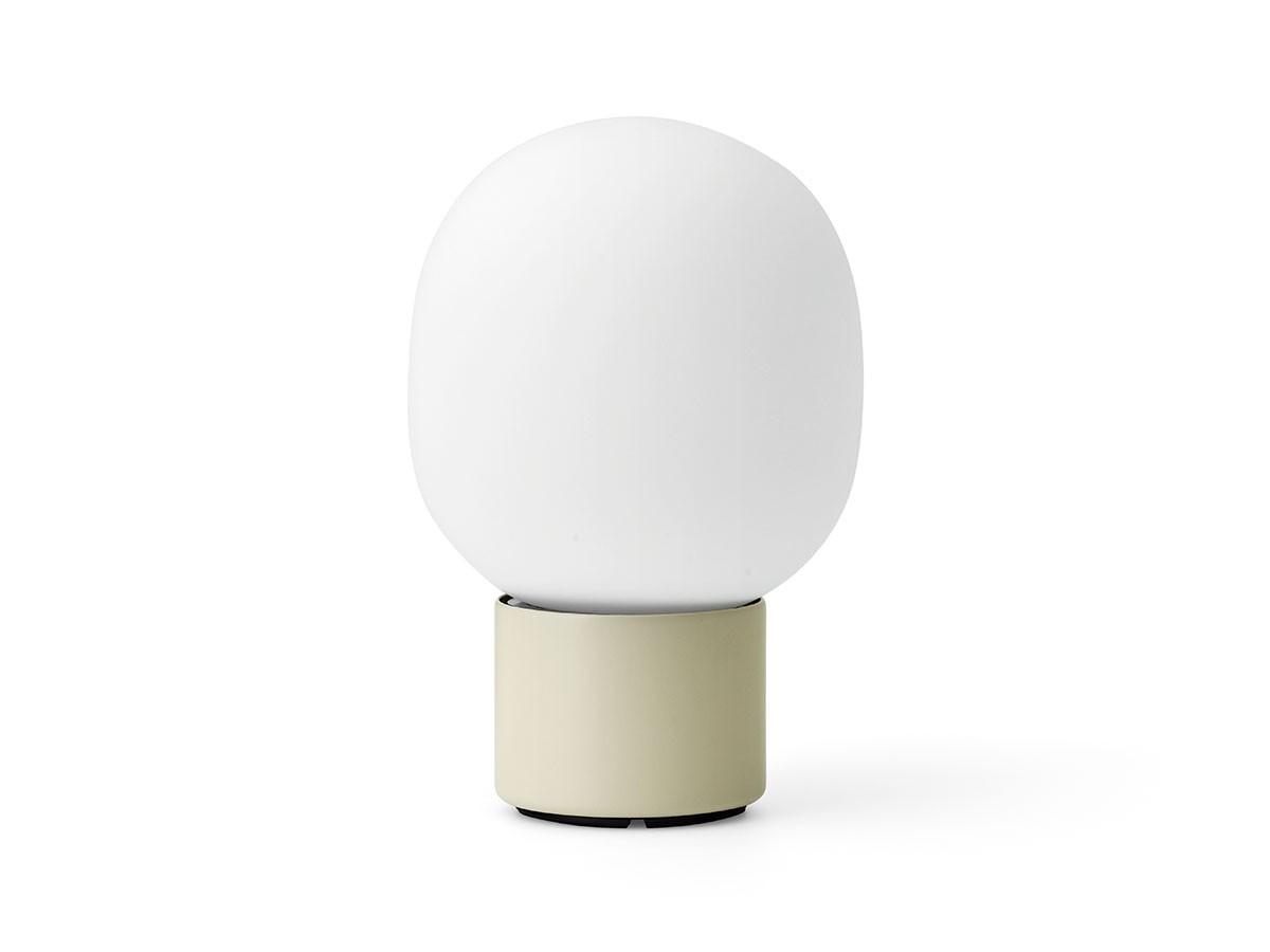 Minimal table lamp photographed on a clean white background showcasing its simple geometric form and premium finish.