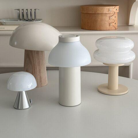 Collection of minimalist table lamps featuring contemporary forms and premium decorative finishes.