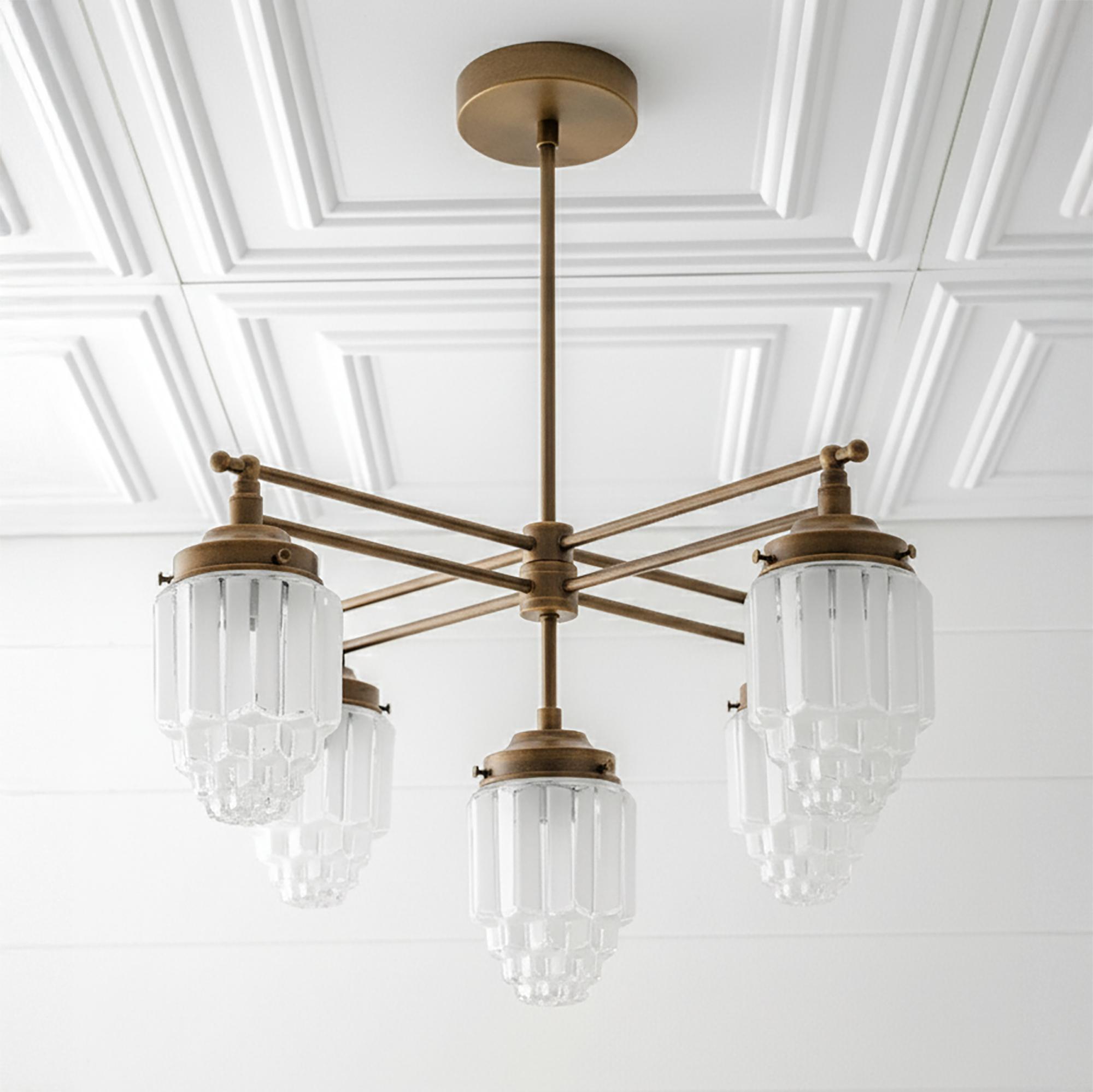 Front view of an elegant Art Deco chandelier with geometric detailing.