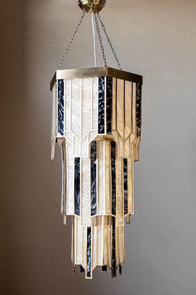 Front view of an elegant Art Deco chandelier with geometric detailing.