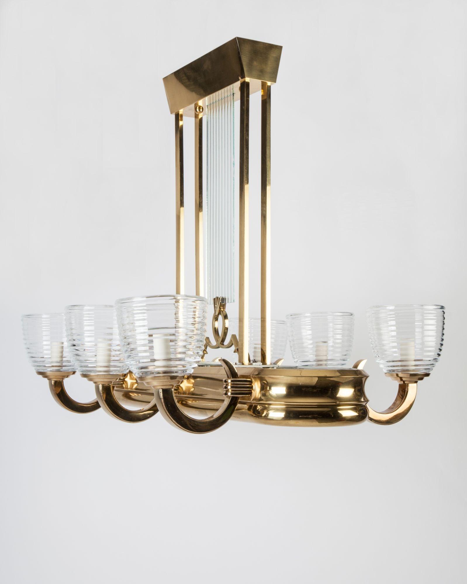Front view of an elegant Art Deco chandelier with geometric detailing.