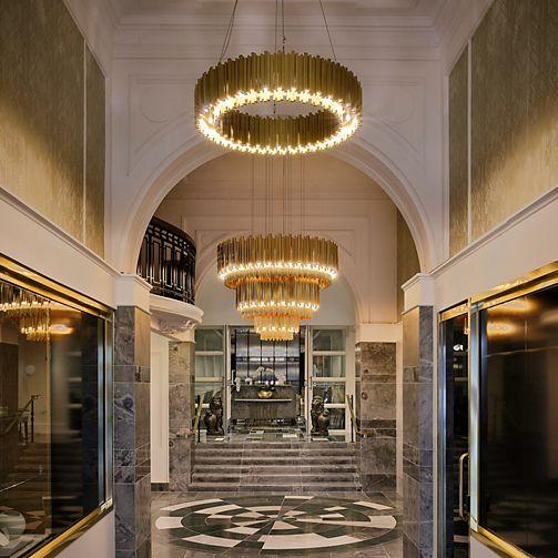 Art Deco chandelier installed in a luxury hospitality interior.