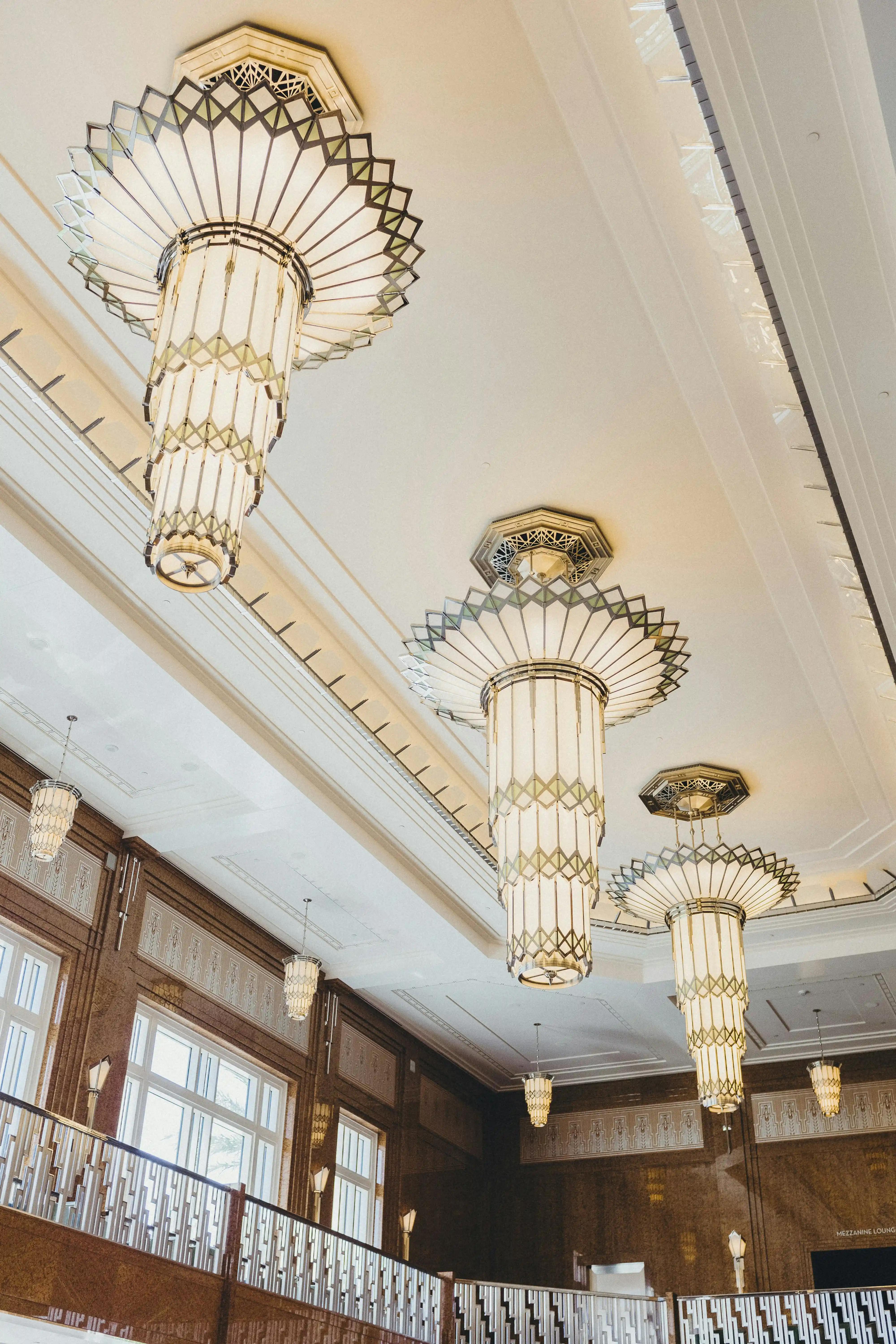 Art Deco chandelier installed in a luxury hospitality interior.