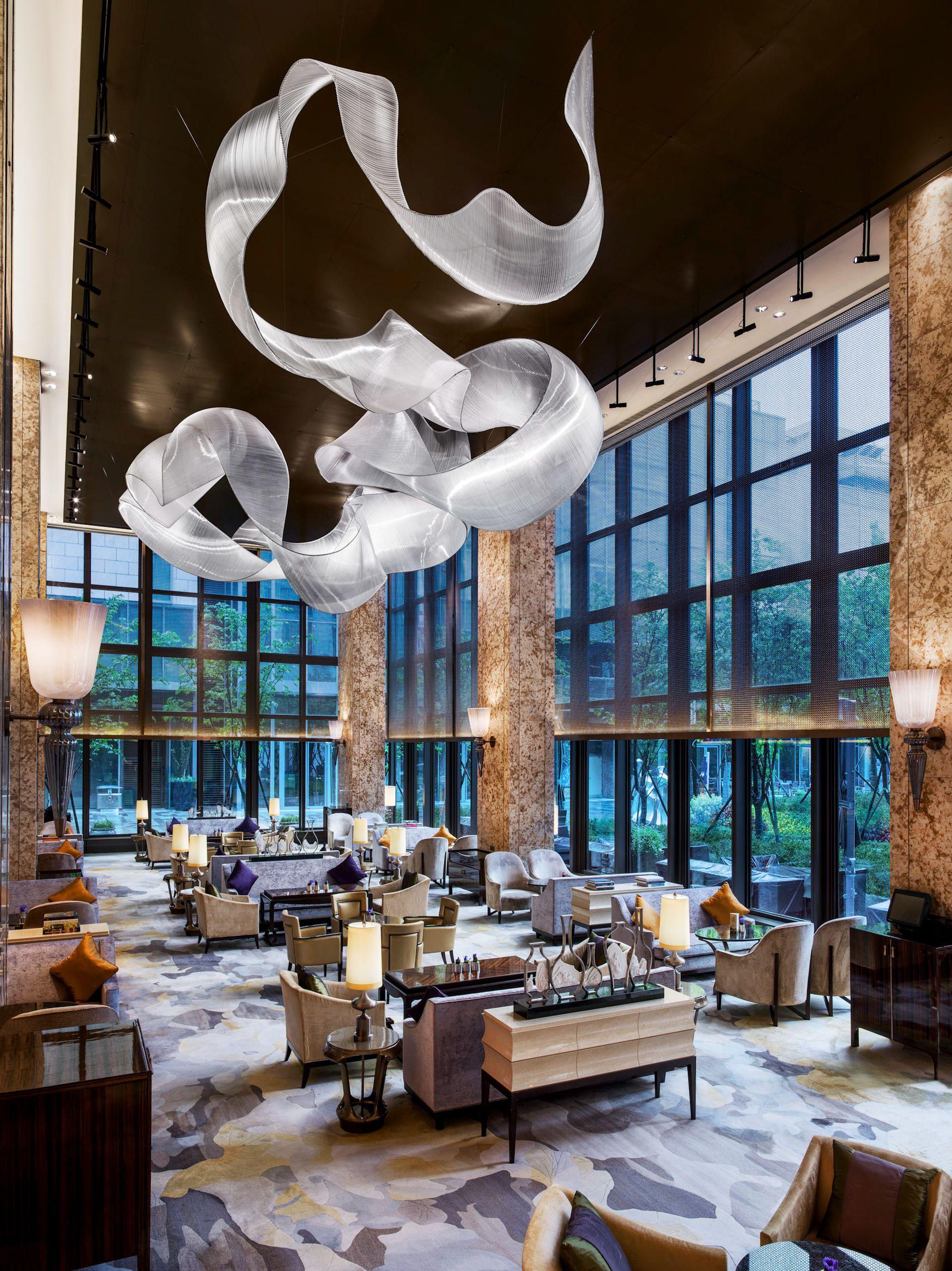 Sculptural chandelier installed in a contemporary hospitality or cultural interior.