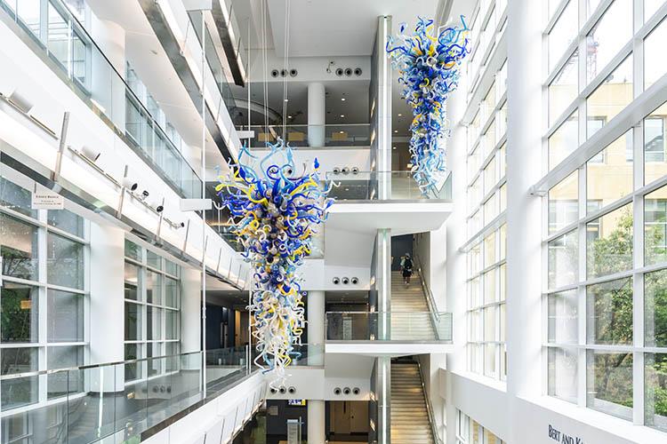 Sculptural chandelier installed in a contemporary hospitality or cultural interior.