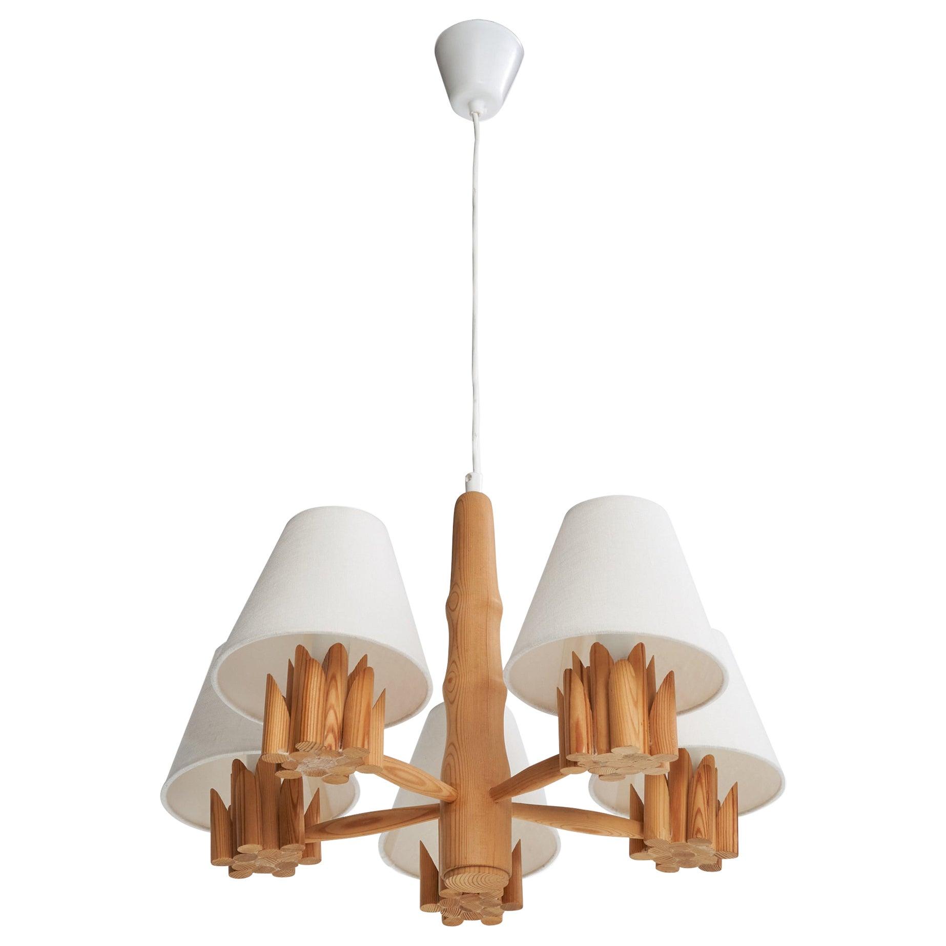 Scandinavian chandelier photographed on a clean white studio background.