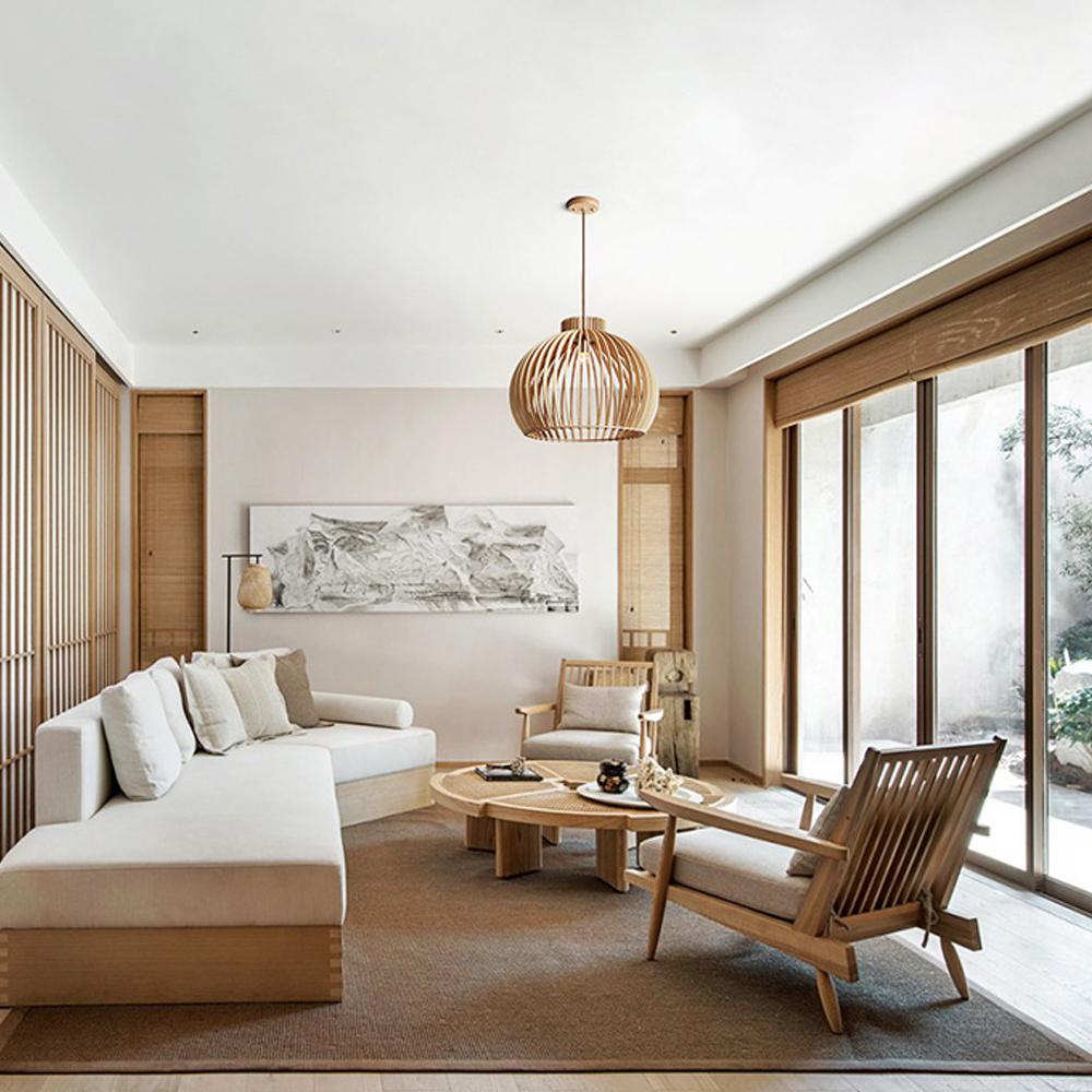 Scandinavian chandelier installed above a contemporary dining area in a modern residential interior.