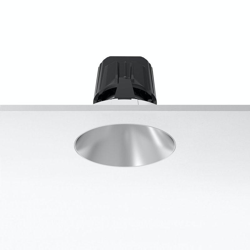 Front view of a trimless recessed architectural downlight.