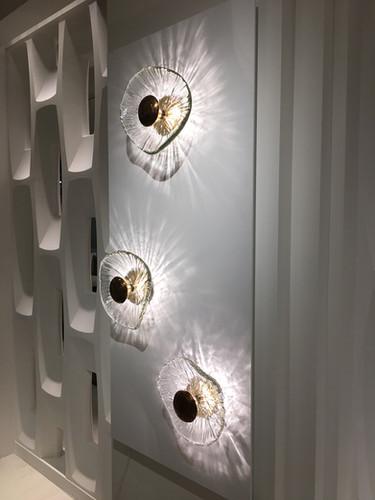 Bespoke wall lighting collection showcasing a variety of project-specific decorative designs.
