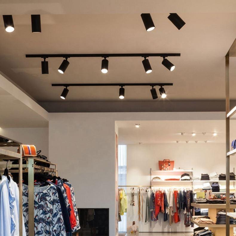 Magnetic track spotlights installed in a contemporary retail interior.