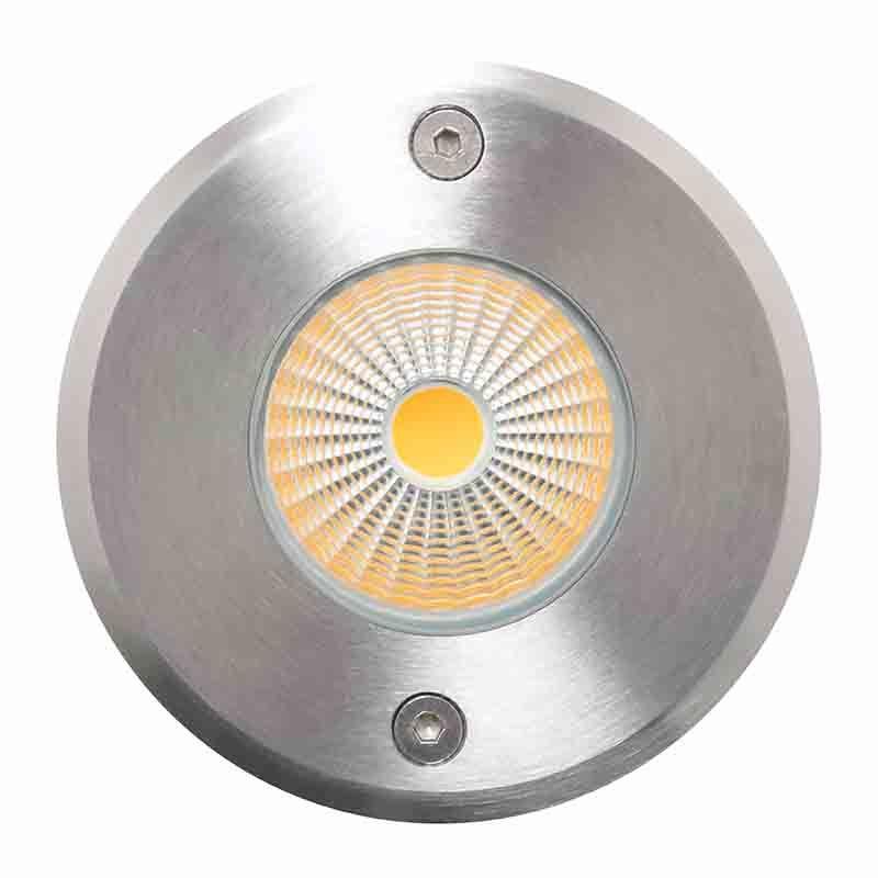 Front view of a round inground light.