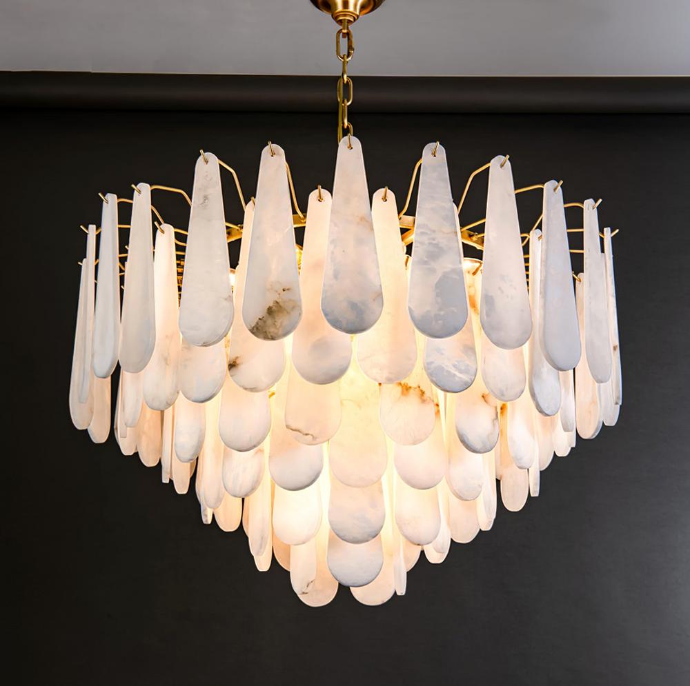Front view of a luxury marble chandelier highlighting the natural veining and elegant architectural design.