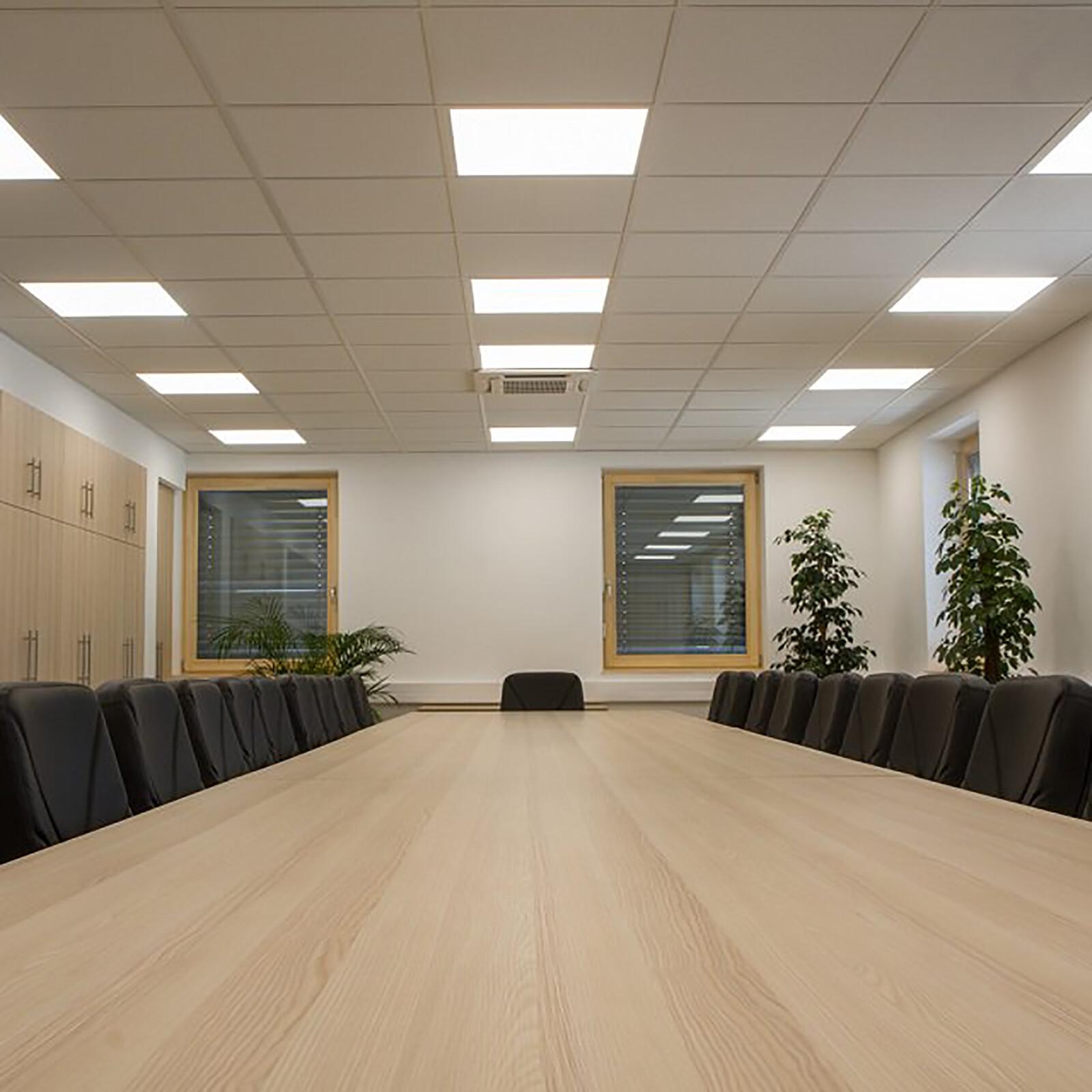 Recessed low-glare panel lighting creating a comfortable visual environment in a contemporary office meeting space