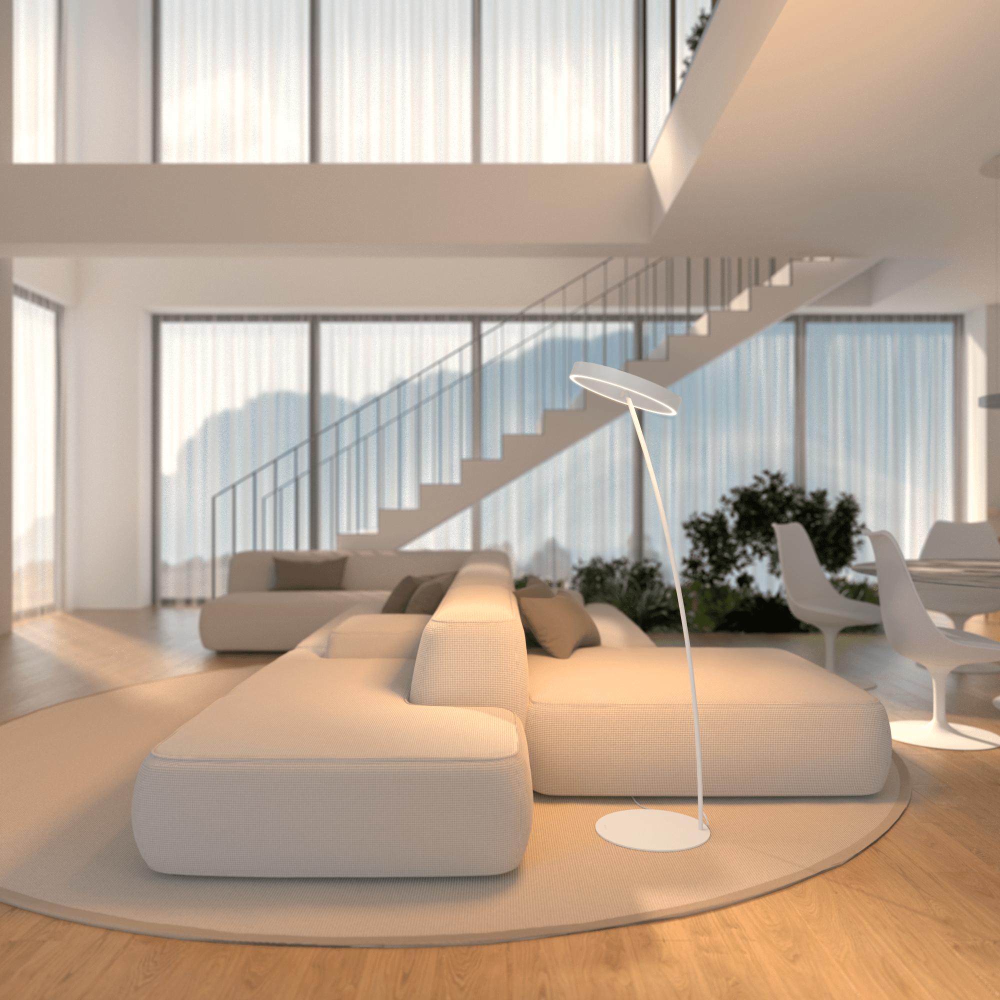 Minimal floor lamp positioned beside a contemporary sofa in a luxury residential living room, creating warm ambient illumination.
