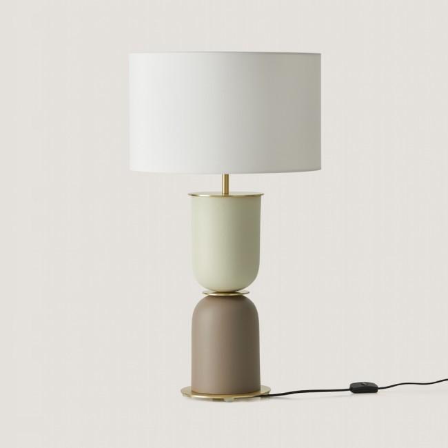 Front view of a bedside table lamp highlighting refined detailing and warm contemporary styling.