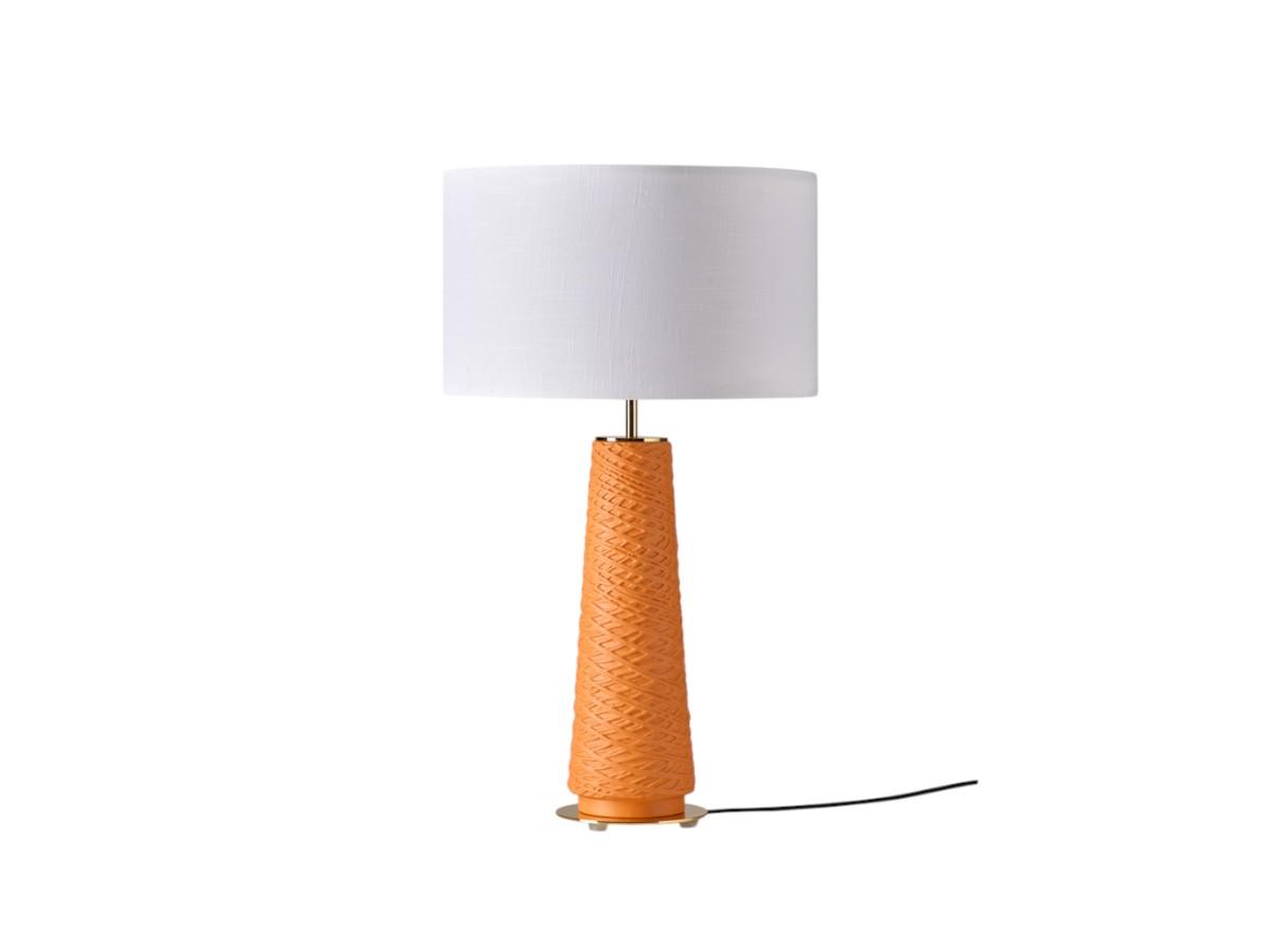 Bedside table lamp photographed on a clean white background showcasing elegant proportions and premium materials.