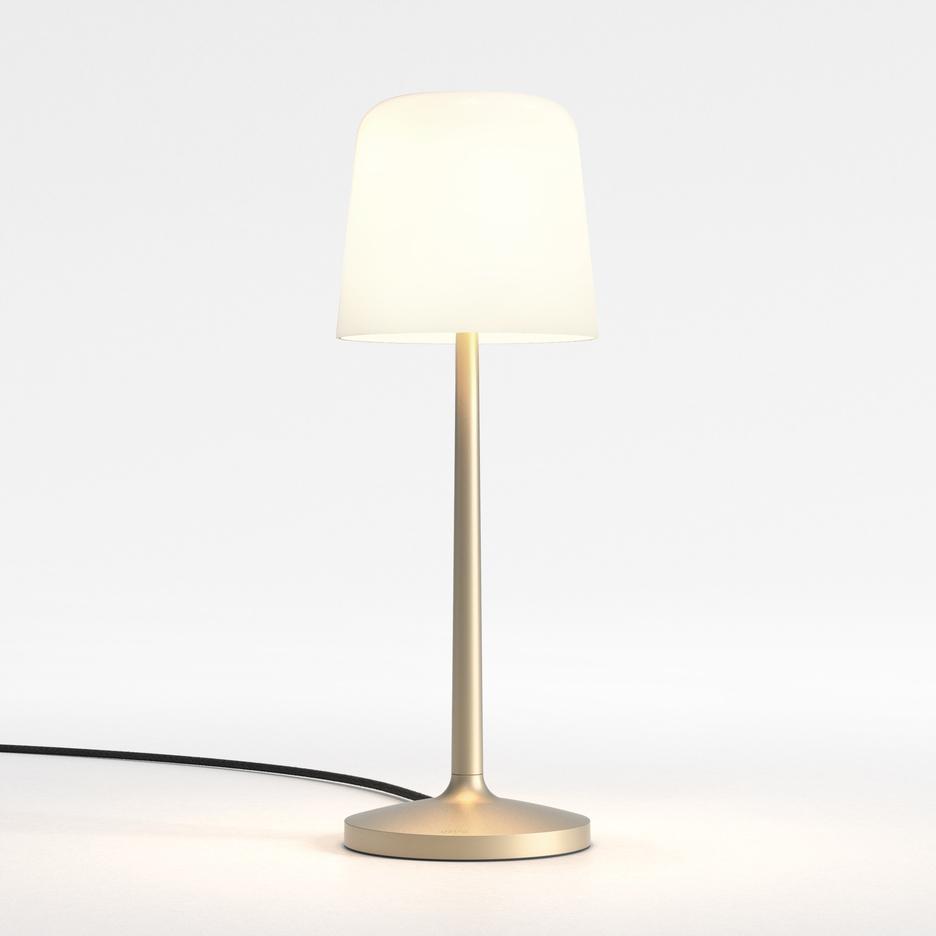 Front view of a bedside table lamp highlighting refined detailing and warm contemporary styling.