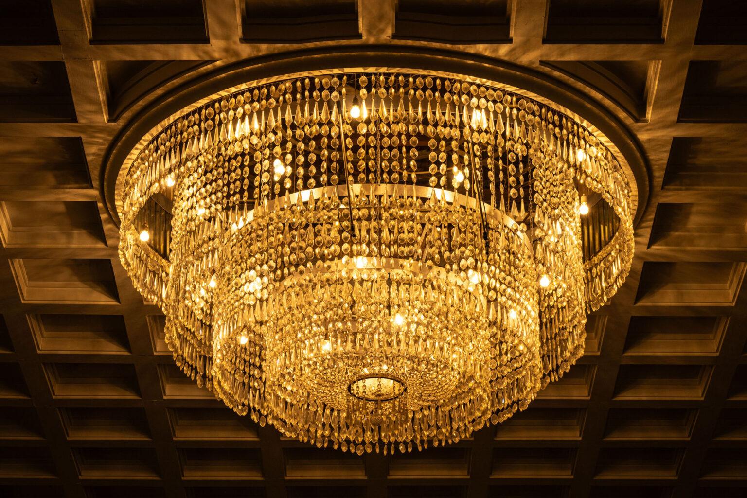 Decorative crystal ceiling lighting integrated into an elegant cultural interior