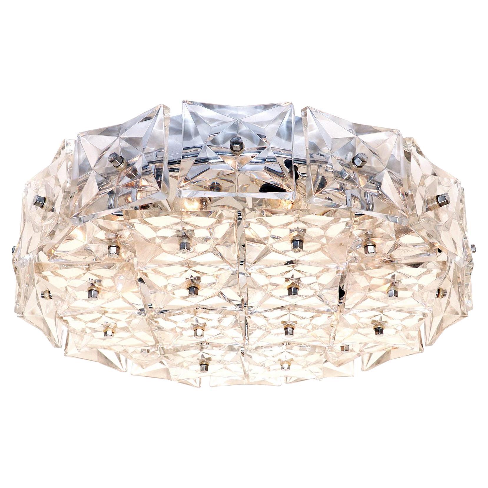 Crystal flush mount ceiling light with layered clear crystal elements on a white background