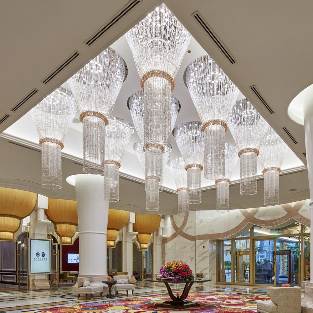 Crystal ceiling lights creating an elegant decorative atmosphere in a luxury hotel lobby