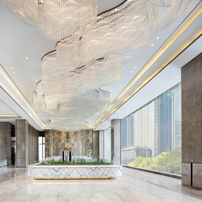 Crystal ceiling lights creating an elegant decorative atmosphere in a luxury hotel lobby