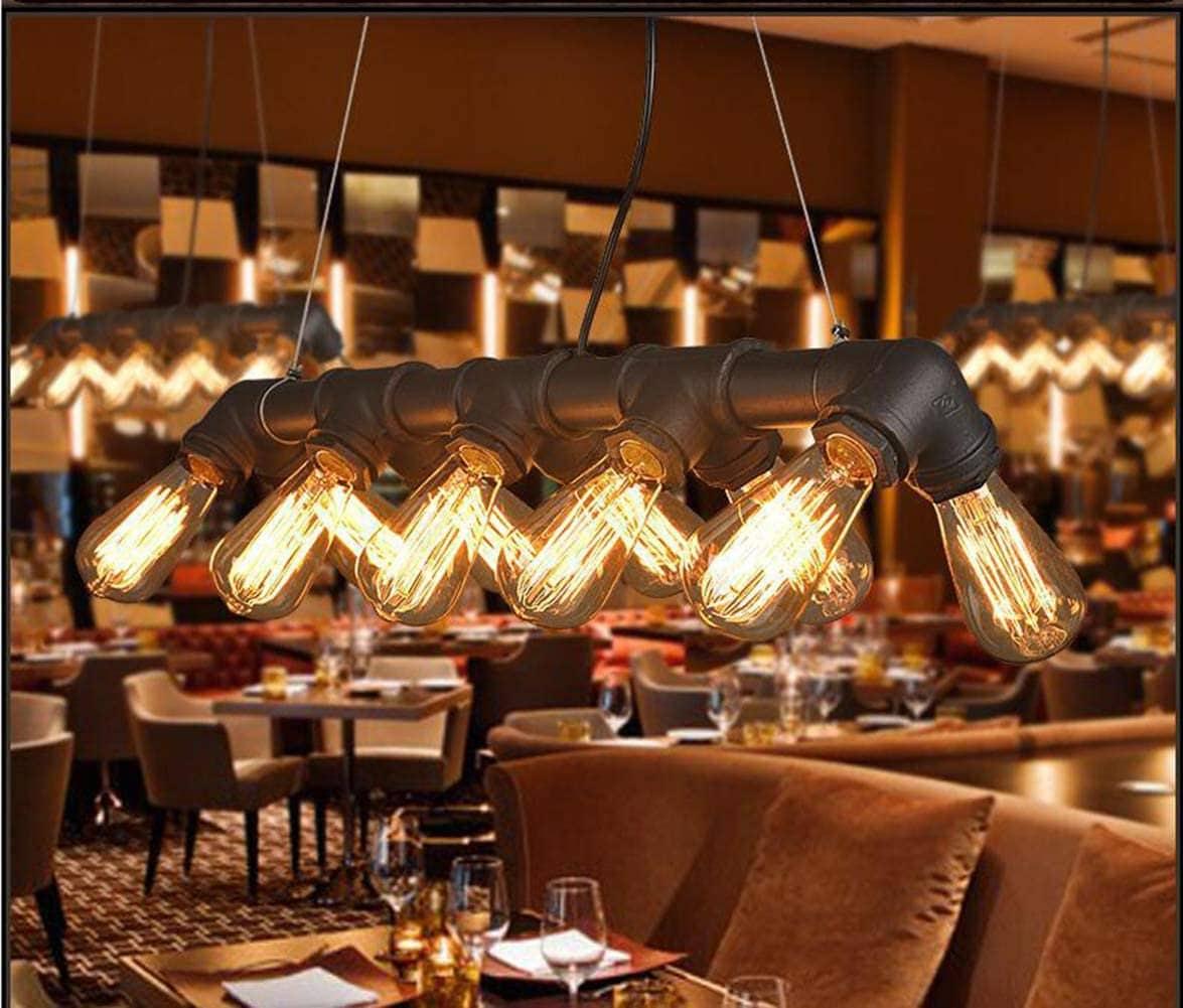 A pipe-based decorative ceiling light combining exposed metal fittings with warm filament bulbs.