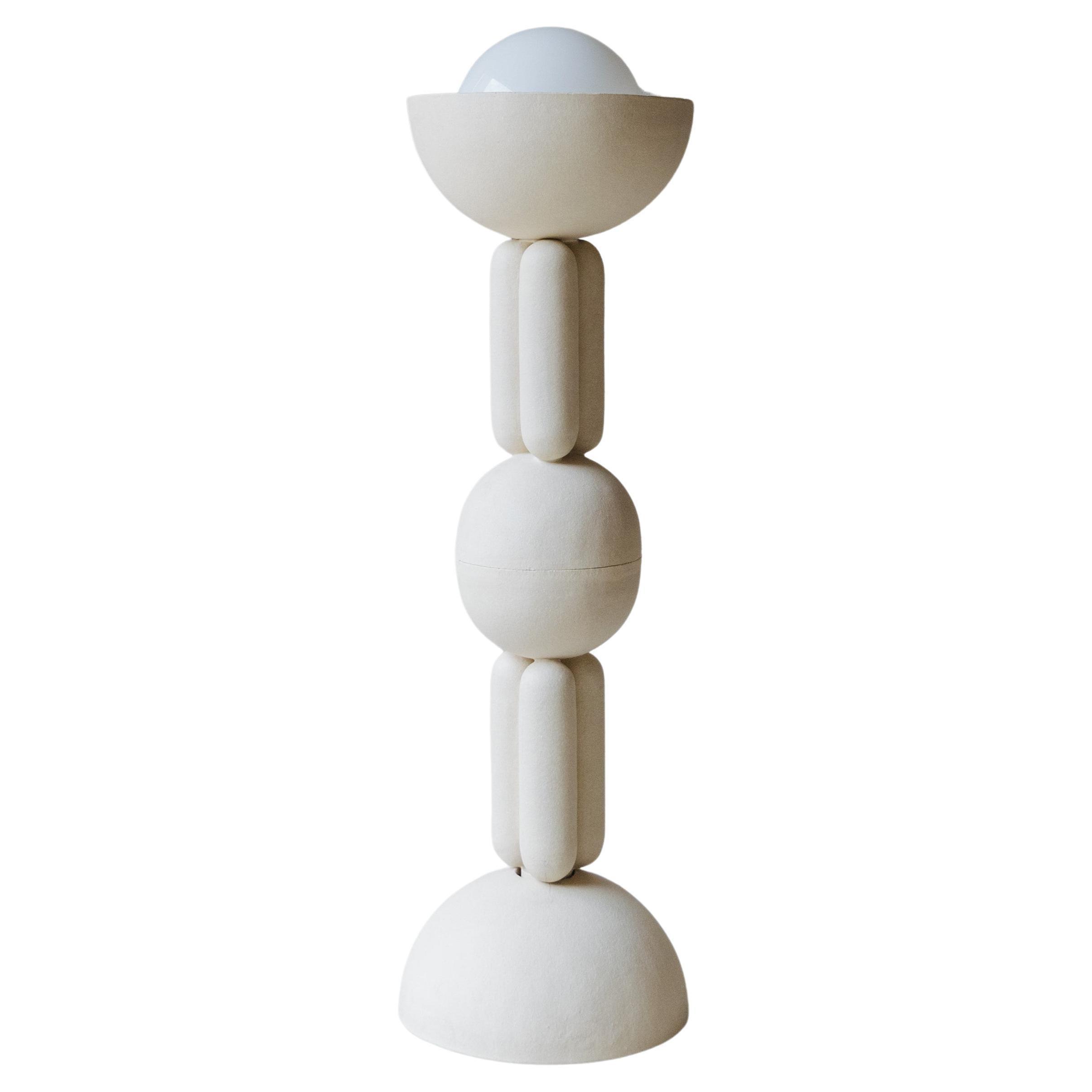 Sculptural floor lamp photographed on a clean white background showcasing its expressive artistic form and premium craftsmanship.