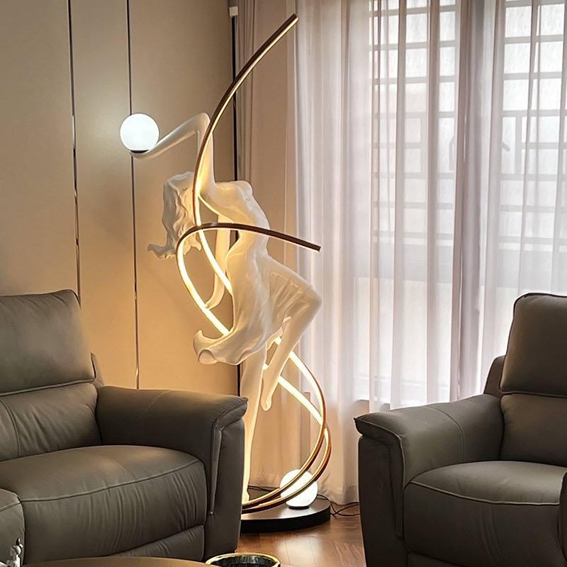 Sculptural floor lamp positioned in a luxury hotel lobby creating a dramatic architectural focal point with warm ambient illumination.