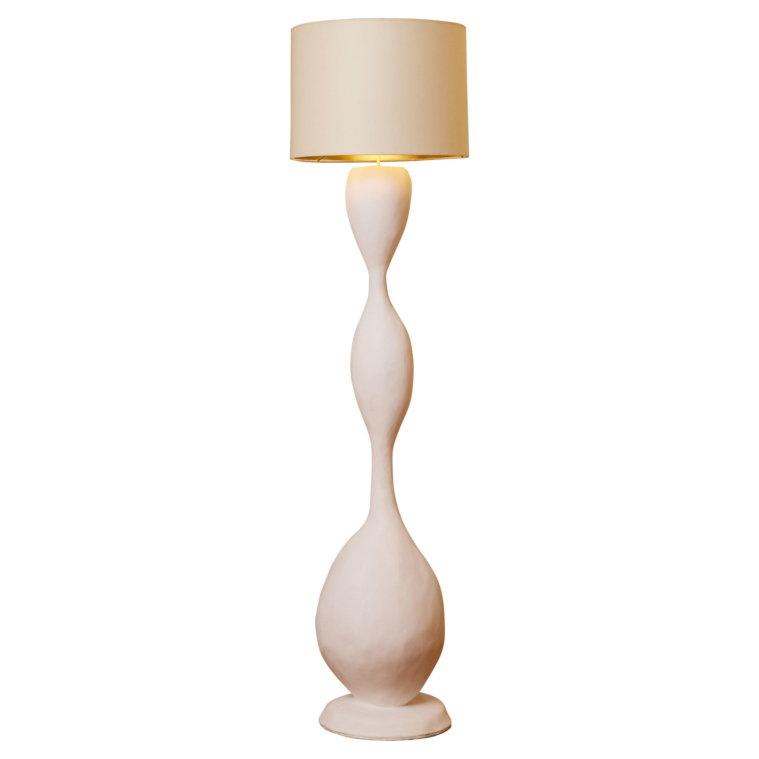 Sculptural floor lamp photographed on a clean white background showcasing its expressive artistic form and premium craftsmanship.