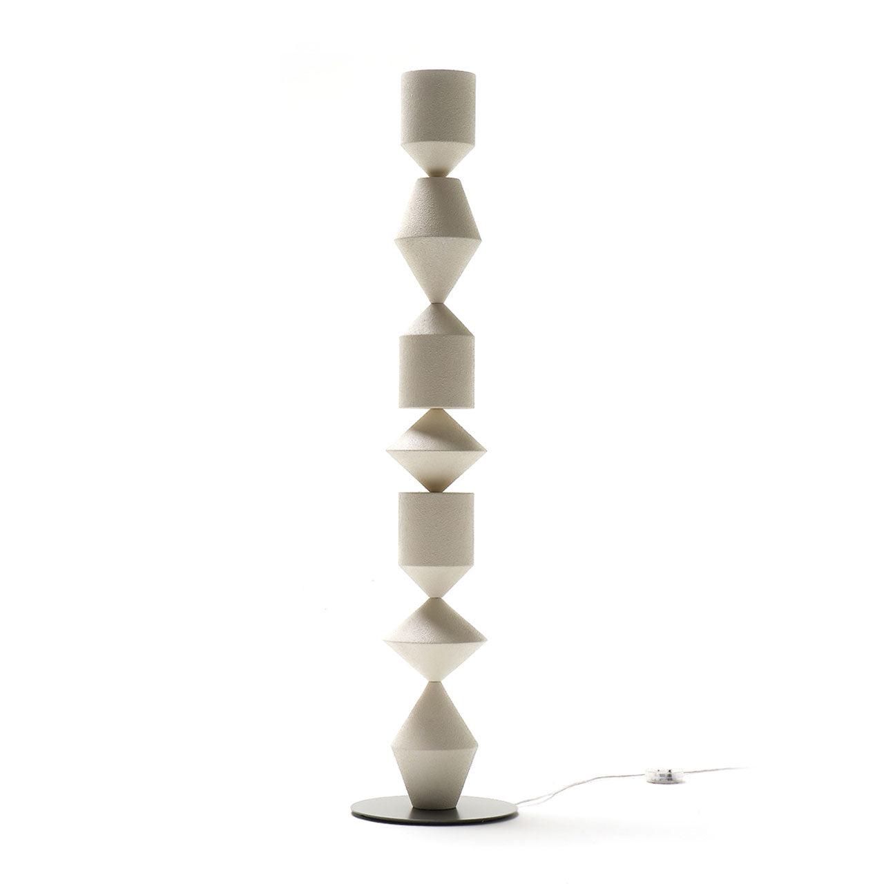 Sculptural floor lamp photographed on a clean white background showcasing its expressive artistic form and premium craftsmanship.