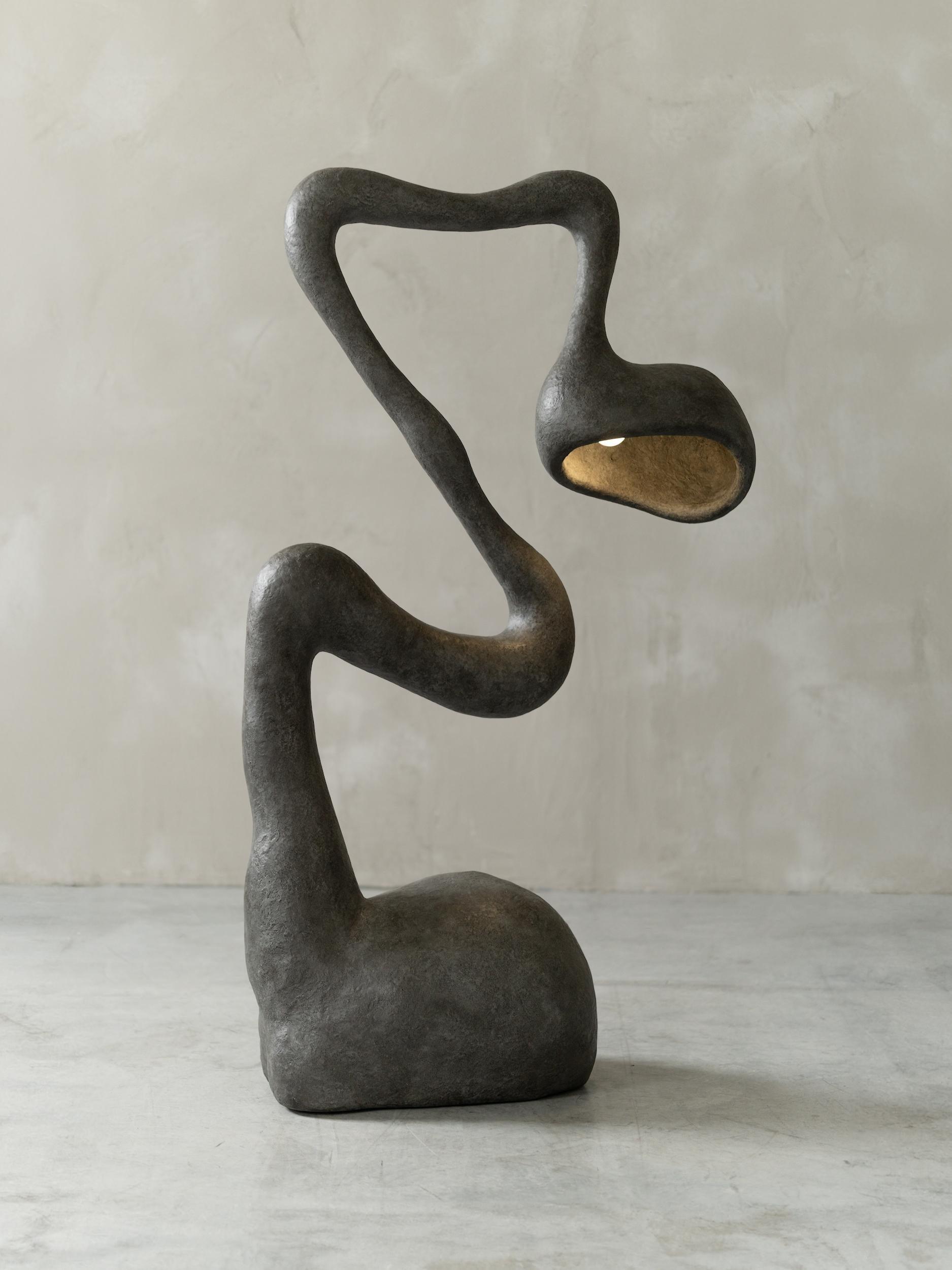 Front view of a sculptural floor lamp highlighting abstract geometry, elegant proportions and refined architectural detailing.