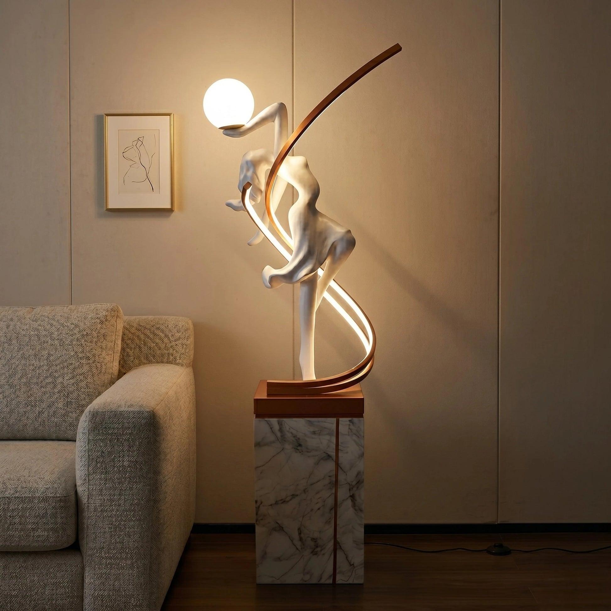 Sculptural floor lamp positioned in a luxury hotel lobby creating a dramatic architectural focal point with warm ambient illumination.