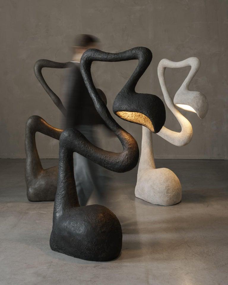 Collection of sculptural floor lamps featuring contemporary artistic forms and premium decorative finishes.