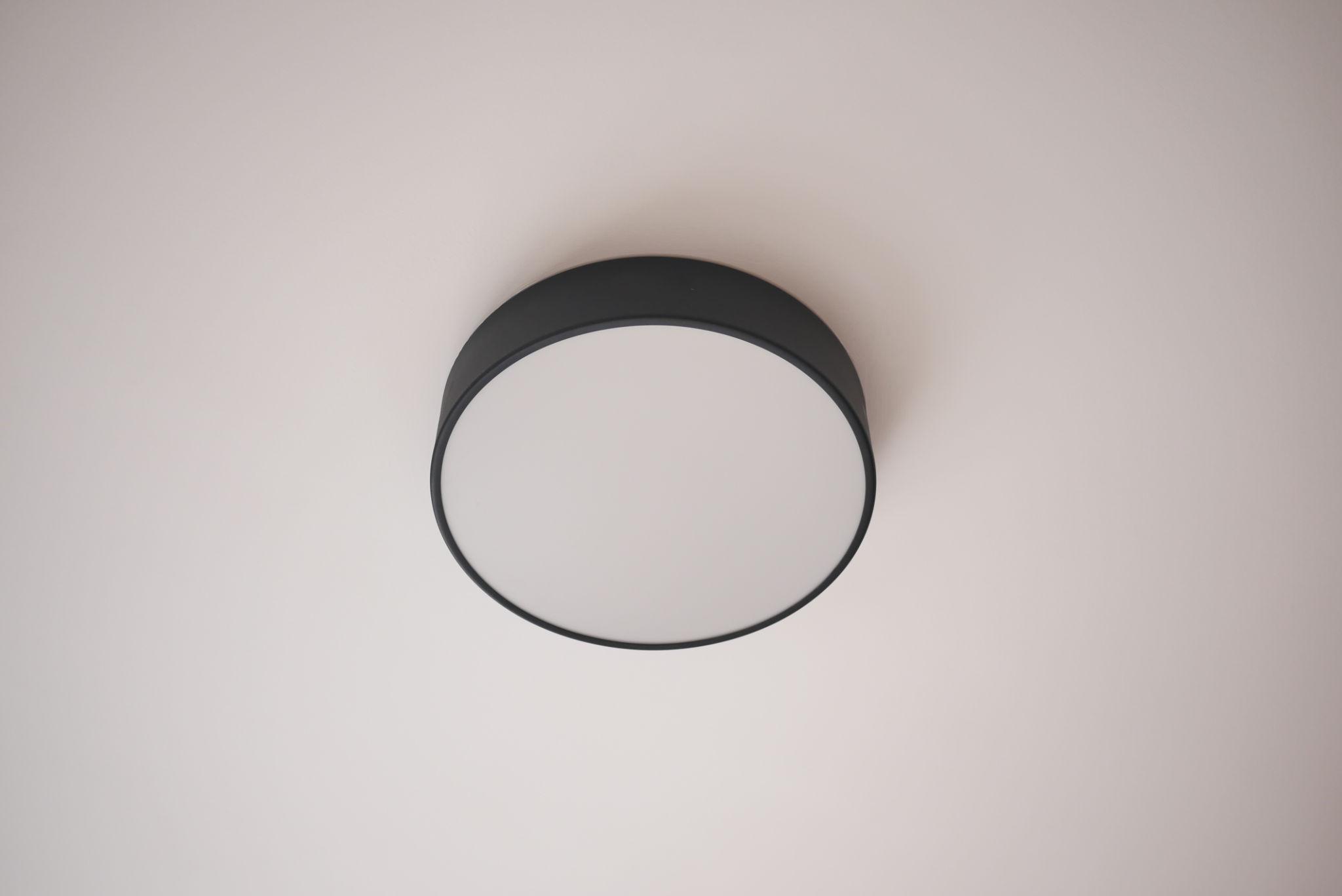 Front view of a minimalist ceiling-mounted decorative light highlighting its clean proportions and premium finish.