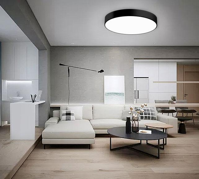 Minimal ceiling-mounted decorative light integrated into a contemporary hospitality interior providing soft ambient illumination.
