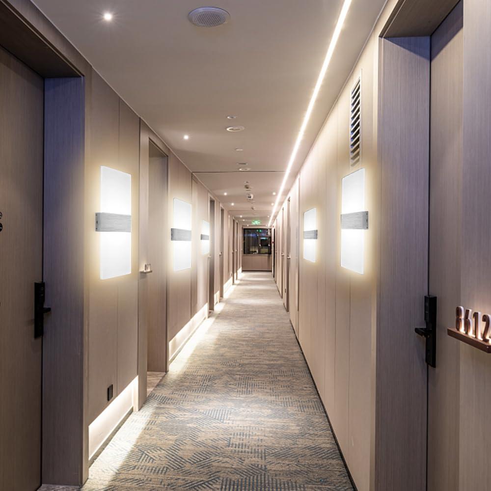 Modern wall lamp installed in a luxury hospitality interior with refined architectural detailing.