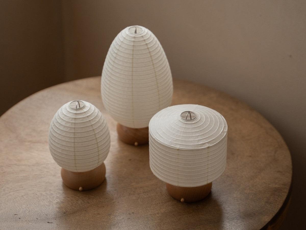 Collection of Scandinavian table lamps featuring wood, metal and fabric combinations inspired by Nordic interiors.