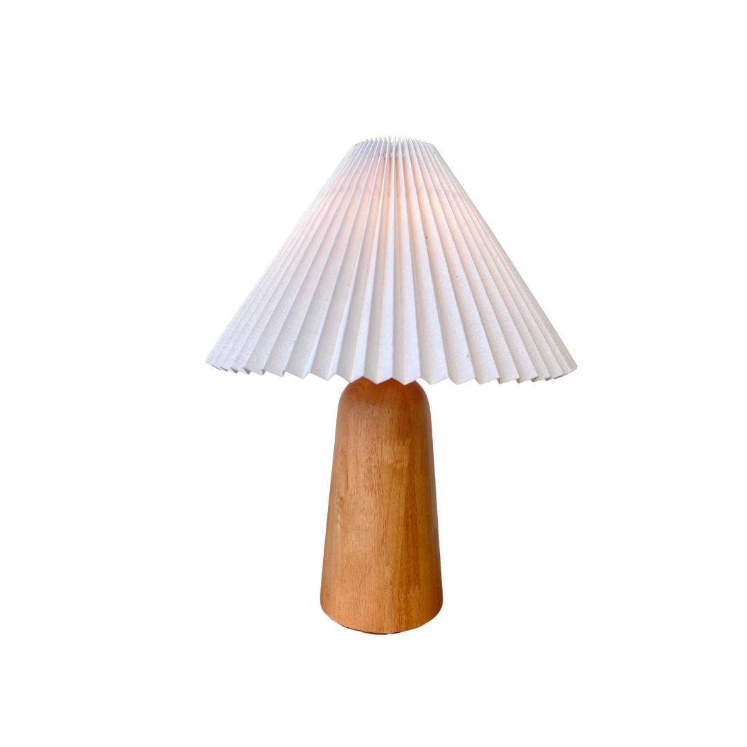 Scandinavian table lamp photographed on a clean white background showcasing natural materials and minimalist Nordic design.