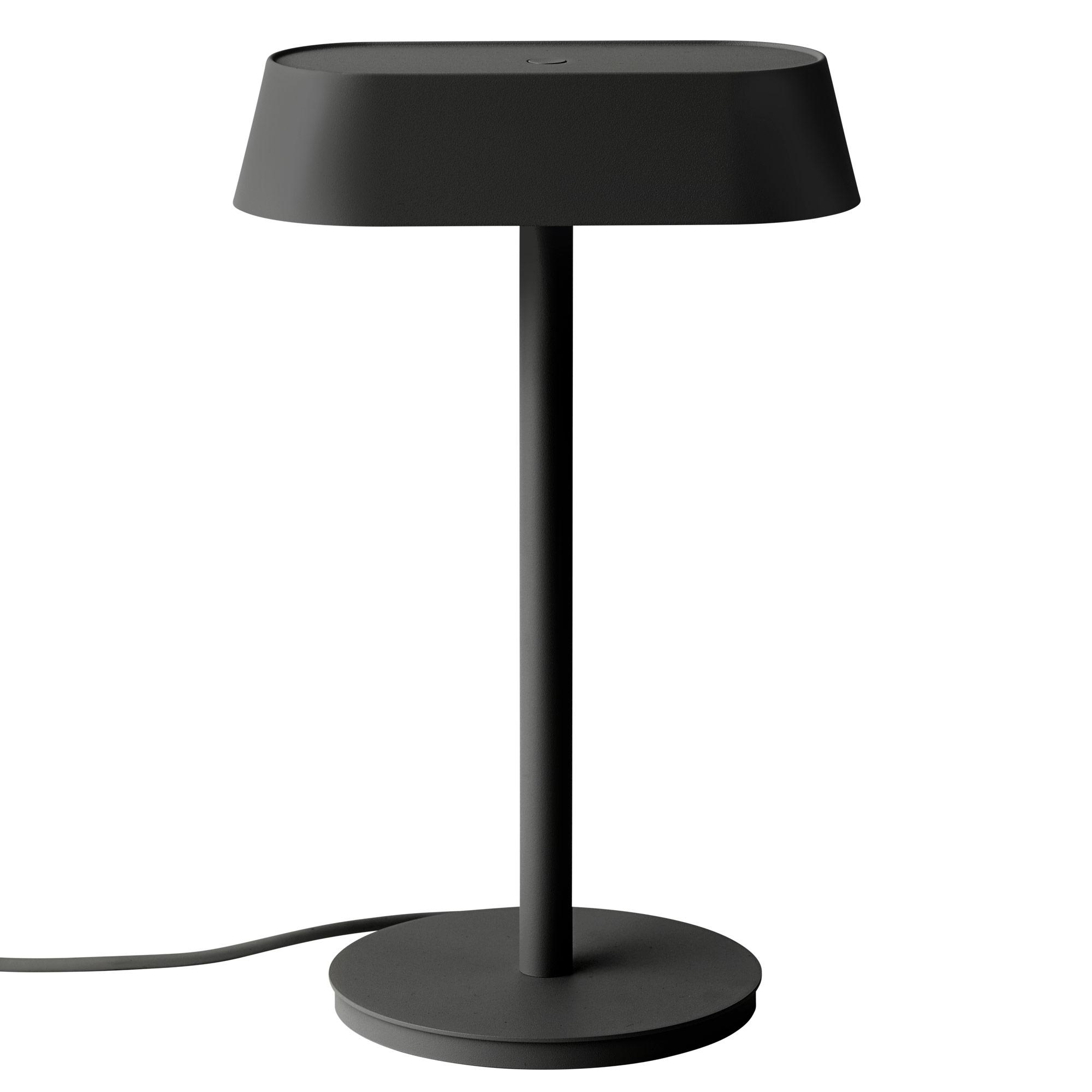 Front view of a Scandinavian table lamp highlighting its balanced proportions and elegant natural finishes.