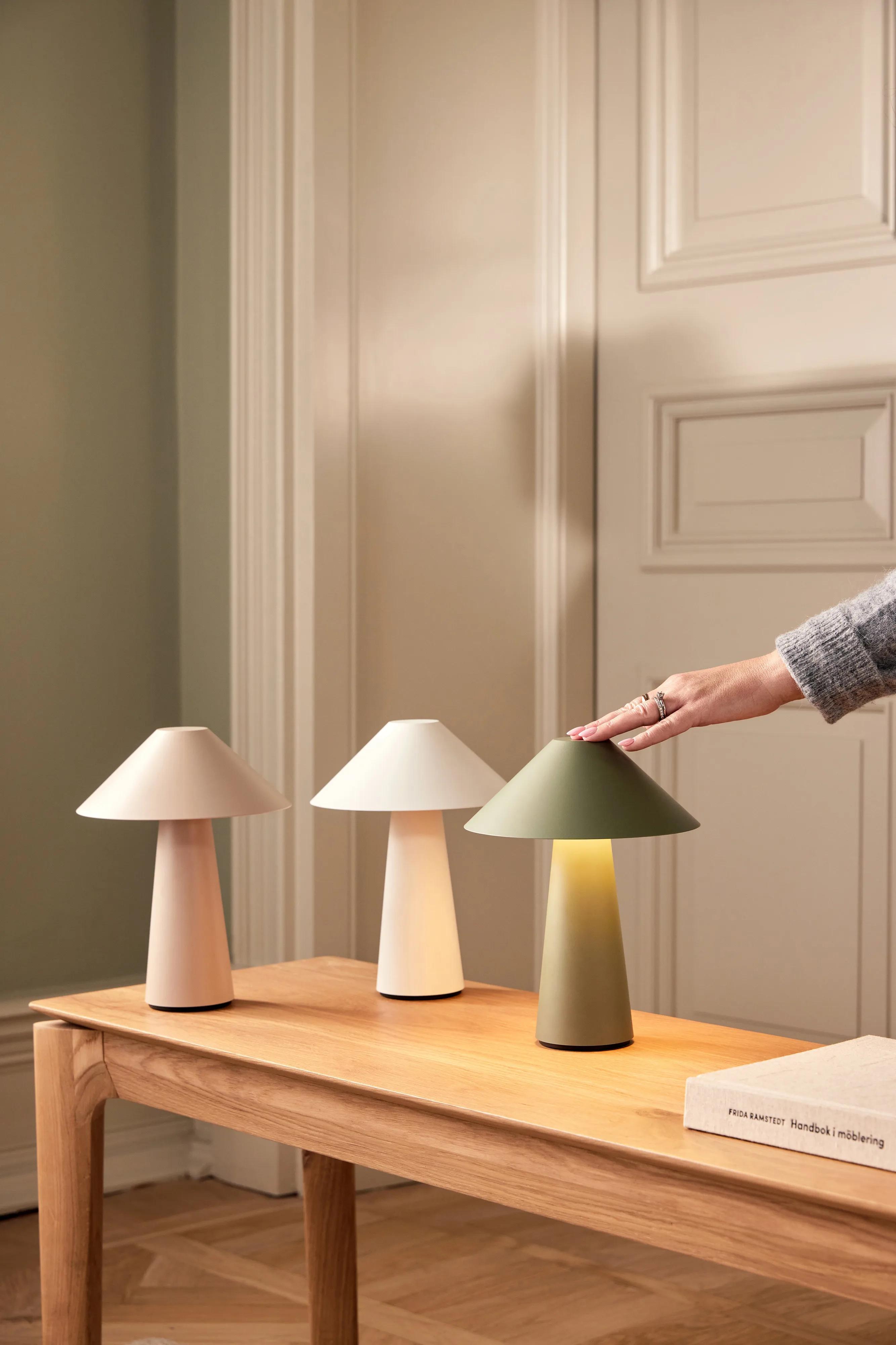 Collection of Scandinavian table lamps featuring wood, metal and fabric combinations inspired by Nordic interiors.