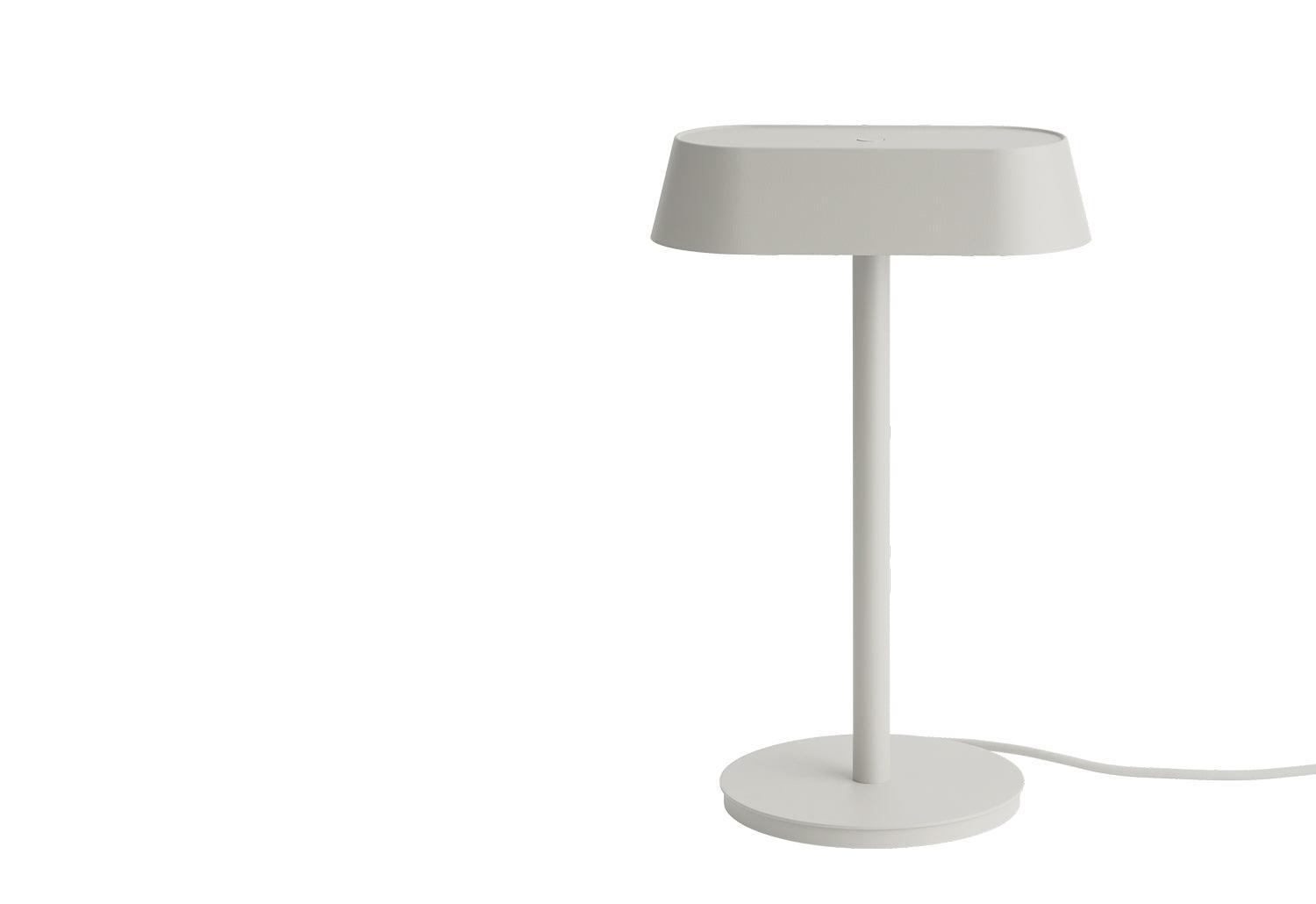 Scandinavian table lamp photographed on a clean white background showcasing natural materials and minimalist Nordic design.