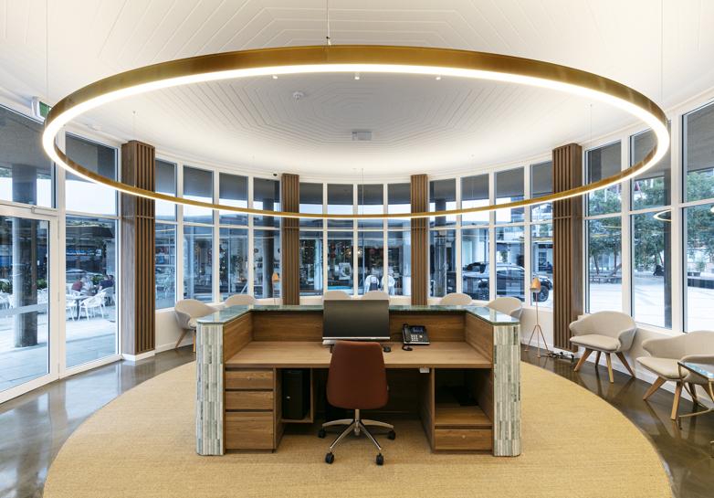 Ring pendant lighting installed in a modern office lobby.