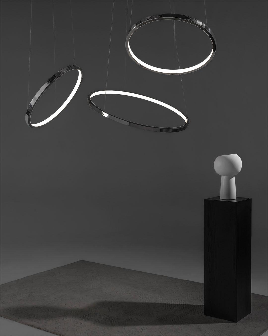 Ring pendant lighting installed in a modern office lobby.
