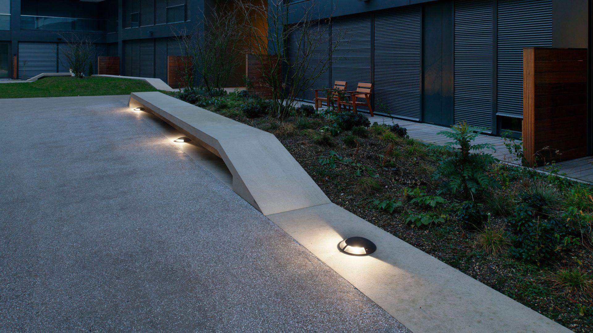 Drive over inground lights installed in a contemporary driveway and public infrastructure project.