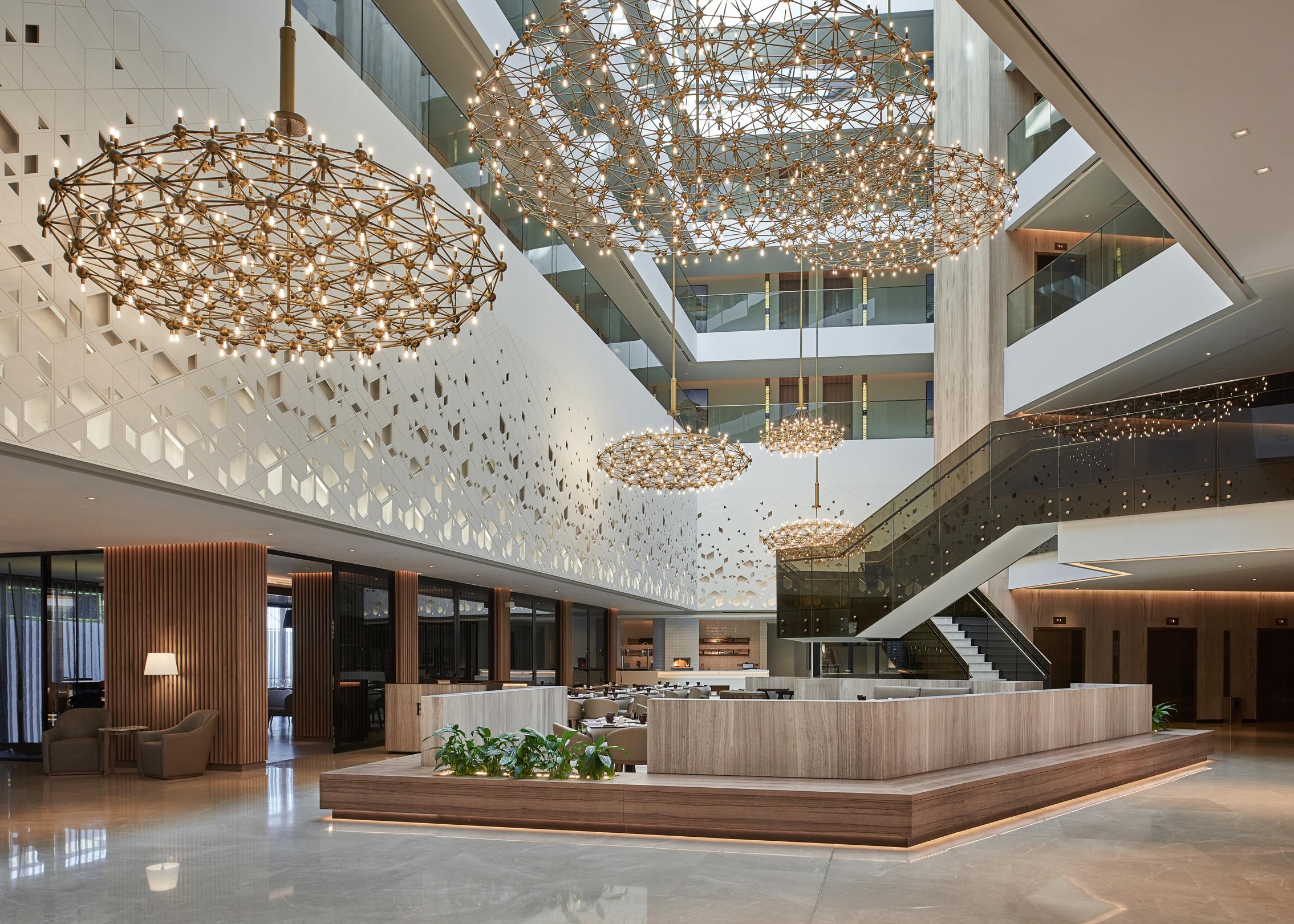 Modern chandelier installed in a premium hospitality interior.